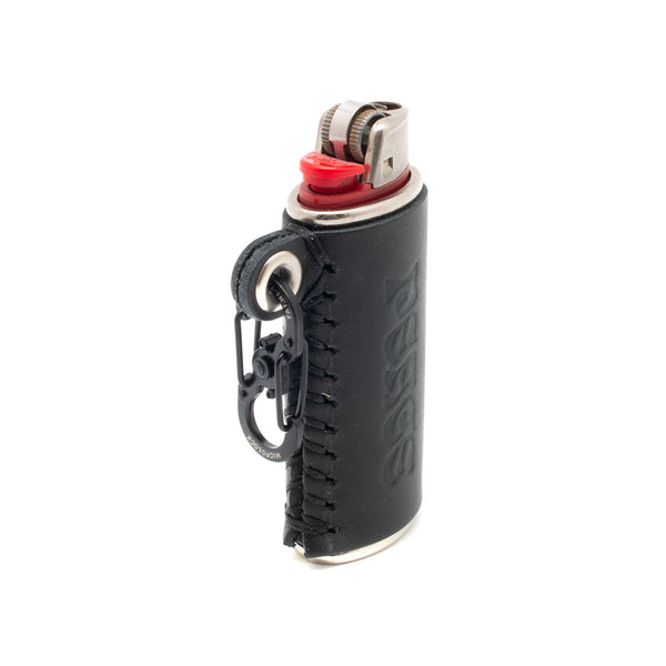 ALL CAPS STUDIO + Alterior - Lumumba Lighter Keychain - Black